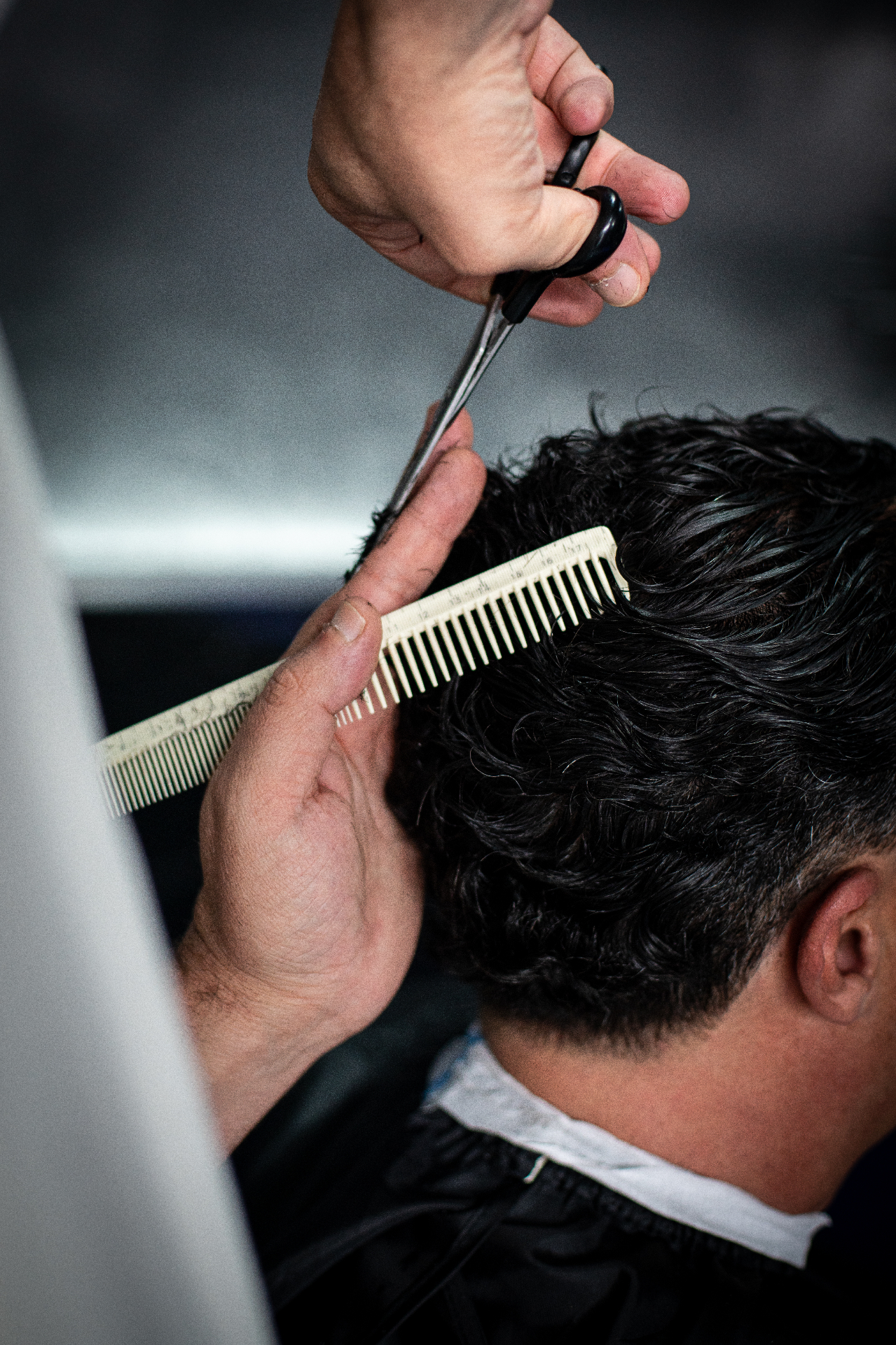 Precision scissor work in the chair